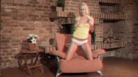 Carla Cox on her knees pulling down her yellow sexy skirt during anaglyph striptease
