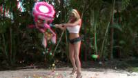 big boobed blonde wearing glasses and high heels wacking the pinata in real 3d