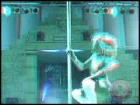 stereoscopic blonde doing poledancing striptease during erotic fair in belgium