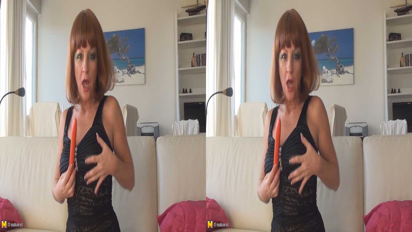 mature redhead masturbating in 3D TV porn photo