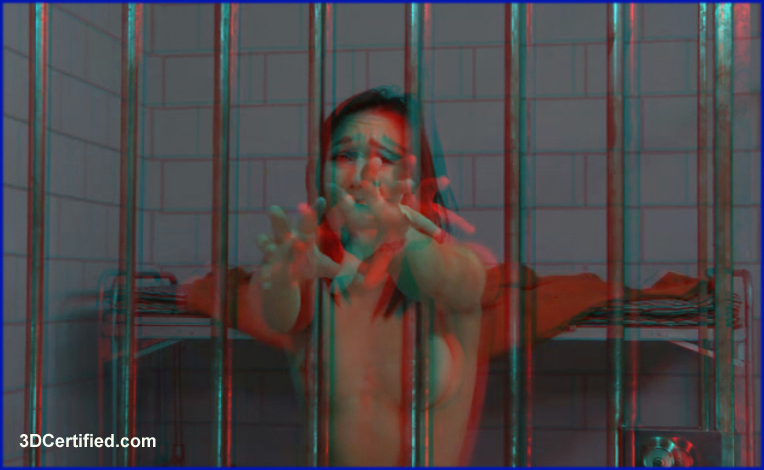 anaglyph softcore image of a brunette naked behind prison bars