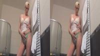 blonde granny with glasses strips in her bathroom in true color 3D